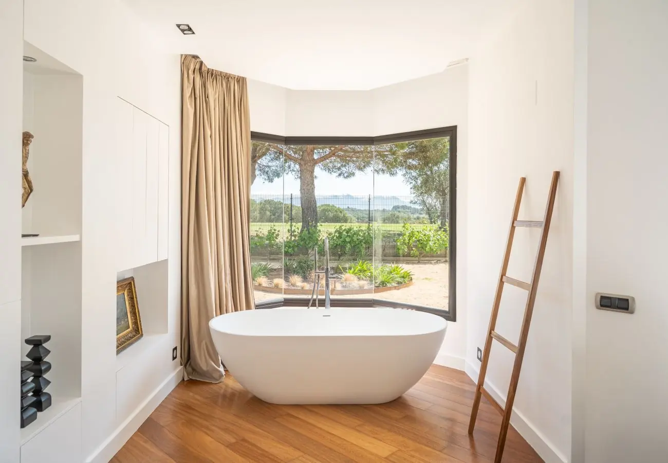 Master suite — freestanding bath overlooking the vineyard