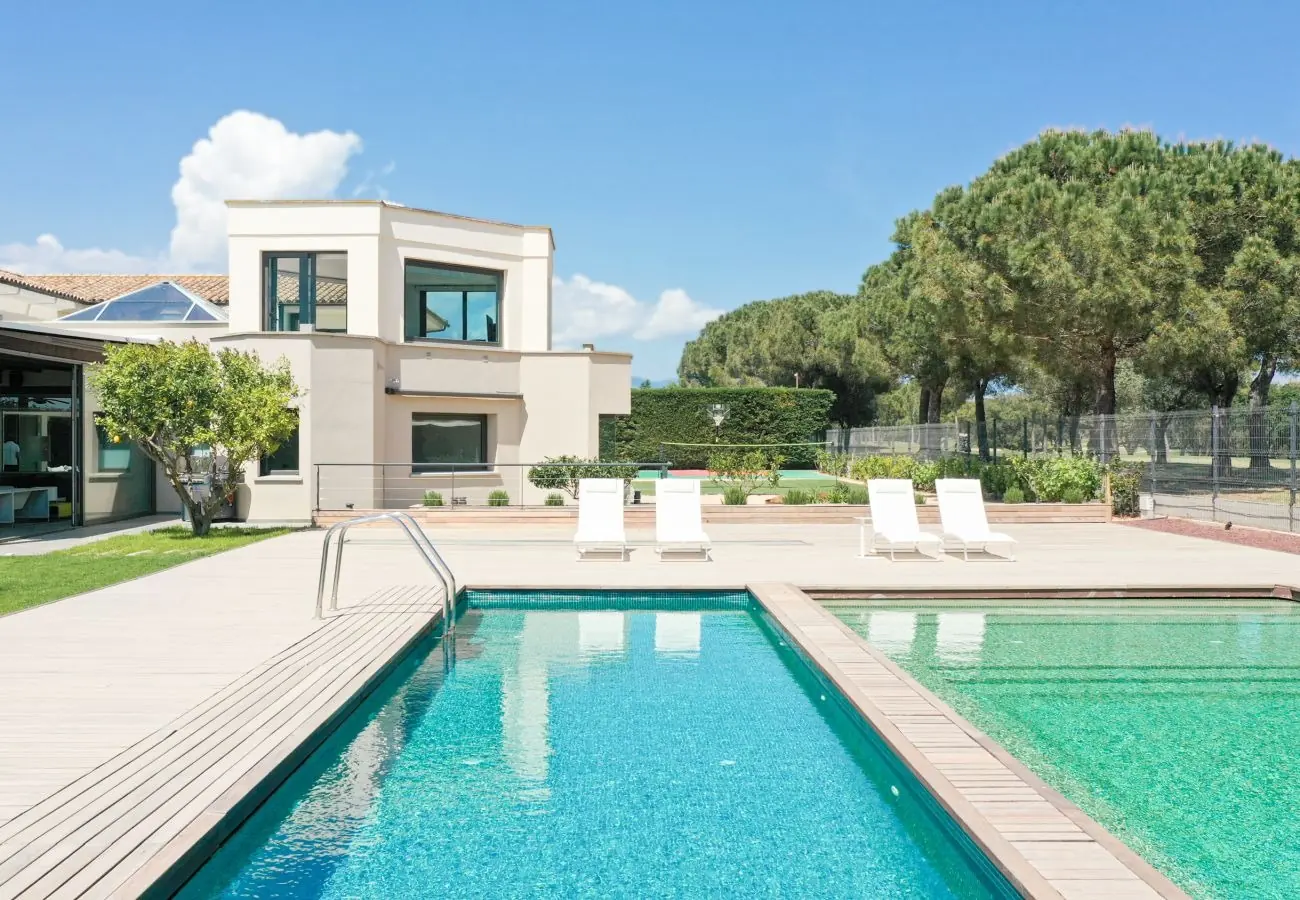 Pool with villa and mountain backdrop
